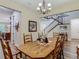 Dining room features wood flooring and elegant chandelier at 13525 Gorgona Isle Dr, Windermere, FL 34786