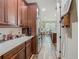 Spacious kitchen with stainless steel appliances and wood-look tile flooring at 13525 Gorgona Isle Dr, Windermere, FL 34786
