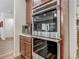 Modern kitchen with built-in microwave and oven offering views of the living area with natural light at 13525 Gorgona Isle Dr, Windermere, FL 34786