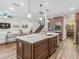Open concept kitchen featuring a center island, stainless steel appliances, and seamless access to living and dining areas at 13525 Gorgona Isle Dr, Windermere, FL 34786
