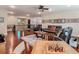 Open-concept living room featuring dark wood floors, leather seating, and stylish decor at 13525 Gorgona Isle Dr, Windermere, FL 34786