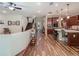 Open-concept living space with a staircase, and a glimpse into the kitchen at 13525 Gorgona Isle Dr, Windermere, FL 34786