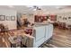 Spacious living area with dark wood floors and a combined kitchen and dining space at 13525 Gorgona Isle Dr, Windermere, FL 34786