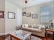Cozy living room featuring a comfortable sofa and natural light at 13525 Gorgona Isle Dr, Windermere, FL 34786