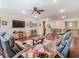 Spacious living room with sleek hardwood floors, entertainment center, and comfortable seating at 13525 Gorgona Isle Dr, Windermere, FL 34786