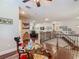 Expansive living room boasts hardwood floors, staircase, and an abundance of natural light at 13525 Gorgona Isle Dr, Windermere, FL 34786