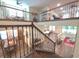 Open loft area overlooking the living spaces below with wrought iron banisters at 13525 Gorgona Isle Dr, Windermere, FL 34786