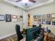 Inviting office with wood floors, decorated walls and an open doorway to the staircase at 13525 Gorgona Isle Dr, Windermere, FL 34786