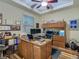 Spacious office featuring desk, storage and a beautiful ceiling fan for comfortable work environment at 13525 Gorgona Isle Dr, Windermere, FL 34786
