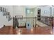 Staircase with ornamental iron spindles and wood handrail leading to the lower level at 13525 Gorgona Isle Dr, Windermere, FL 34786