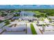 Picturesque aerial view of the community, showcasing a lake, lush greenery, and well-maintained facilities at 1003 Clearpointe Way, Lakeland, FL 33813