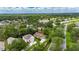 Aerial view of property in lush neighborhood with mature trees and well-kept landscaping at 1003 Clearpointe Way, Lakeland, FL 33813