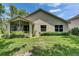 Lush backyard view highlighting the home's well-maintained lawn and exterior at 1003 Clearpointe Way, Lakeland, FL 33813