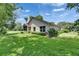 Spacious backyard offering privacy, featuring lush landscaping and mature trees at 1003 Clearpointe Way, Lakeland, FL 33813