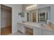 Bathroom featuring double sinks, vanity space, and a large mirror with recessed lighting, creating a bright and functional area at 1003 Clearpointe Way, Lakeland, FL 33813