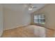 Inviting bedroom features hardwood floors, vaulted ceilings, a ceiling fan, and a window offering serene outdoor views at 1003 Clearpointe Way, Lakeland, FL 33813