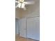 Bedroom closet with bifold doors and a view of a hallway, bedroom, and bathroom at 1003 Clearpointe Way, Lakeland, FL 33813