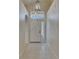 Bright entryway featuring tile flooring, a modern light fixture, and a transom window at 1003 Clearpointe Way, Lakeland, FL 33813