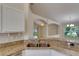 Stylish kitchen with a stainless steel sink and granite countertops at 1003 Clearpointe Way, Lakeland, FL 33813