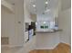 Modern kitchen featuring white cabinets and a breakfast bar at 1003 Clearpointe Way, Lakeland, FL 33813