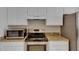 Modern kitchen with stainless steel appliances and granite countertops at 1003 Clearpointe Way, Lakeland, FL 33813