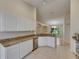 Kitchen with granite counters, stainless appliances, and white cabinets at 1003 Clearpointe Way, Lakeland, FL 33813