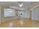Bright living room with light hardwood floors and architectural details at 1003 Clearpointe Way, Lakeland, FL 33813