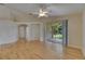 Spacious living area with hardwood floors, glass doors, and an open floor plan at 1003 Clearpointe Way, Lakeland, FL 33813