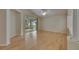 Living room with hardwood floors, high ceilings, and a glass slider to the outdoor patio at 1003 Clearpointe Way, Lakeland, FL 33813