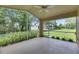 Relaxing screened-in porch offering views of the lush backyard at 1003 Clearpointe Way, Lakeland, FL 33813