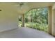A screened-in lanai with a ceiling fan offers seamless indoor-outdoor living at 1003 Clearpointe Way, Lakeland, FL 33813