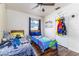 Charming bedroom with two cozy beds, hardwood floors, and natural light at 102 Pike St, Auburndale, FL 33823