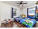 Bright bedroom with two twin beds, hardwood floors, and plenty of natural light at 102 Pike St, Auburndale, FL 33823