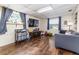Spacious living room featuring hardwood floors and plenty of room for entertaining and relaxation at 102 Pike St, Auburndale, FL 33823