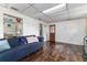 Inviting living room featuring hardwood floors, shelving and bright lighting at 102 Pike St, Auburndale, FL 33823