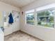 Bright sun room featuring three windows that fills the space with natural light at 102 Pike St, Auburndale, FL 33823