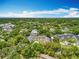 Lush trees line the property, which hosts community pools at 110 N Tremain St # 206, Mount Dora, FL 32757
