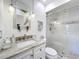 Elegant bathroom featuring a glass shower, vanity, and pendant lighting at 110 N Tremain St # 206, Mount Dora, FL 32757
