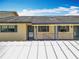 Exterior shot of a condo building, showing the covered walkways and entrances to the units at 110 N Tremain St # 206, Mount Dora, FL 32757