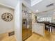 Open kitchen flowing into the dining area, equipped with stainless steel refrigerator at 110 N Tremain St # 206, Mount Dora, FL 32757