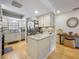 Charming kitchen featuring granite countertops, stainless steel appliances, and ample natural light at 110 N Tremain St # 206, Mount Dora, FL 32757