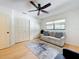 Relaxing room features natural light, a comfortable couch, and ample closet space, providing a serene atmosphere at 110 N Tremain St # 206, Mount Dora, FL 32757