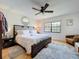 Comfortable bedroom showcasing a plush bed, area rug, and ample natural light at 110 N Tremain St # 206, Mount Dora, FL 32757