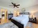 Cozy bedroom featuring a plush bed, nightstands, and serene ambiance at 110 N Tremain St # 206, Mount Dora, FL 32757