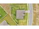 Aerial view shows the roof and surrounding lawn of this attractive single Gathering home at 1146 Enclave Ct., Auburndale, FL 33823