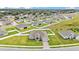 Aerial shot showcases this single Gathering home and its landscaped lawn and driveway at 1146 Enclave Ct., Auburndale, FL 33823