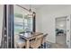Cozy dining area featuring natural light, an elegant chandelier, and comfortable seating at 1146 Enclave Ct., Auburndale, FL 33823