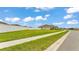 An exterior shot showcases a well-maintained lawn and white picket fence of a beautiful single-Gathering home at 1146 Enclave Ct., Auburndale, FL 33823