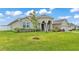 Well-maintained single-story home with lush green lawn and classic architectural details at 1146 Enclave Ct., Auburndale, FL 33823