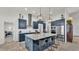 Spacious kitchen featuring an island, stainless steel appliances, and ample cabinet space at 1146 Enclave Ct., Auburndale, FL 33823